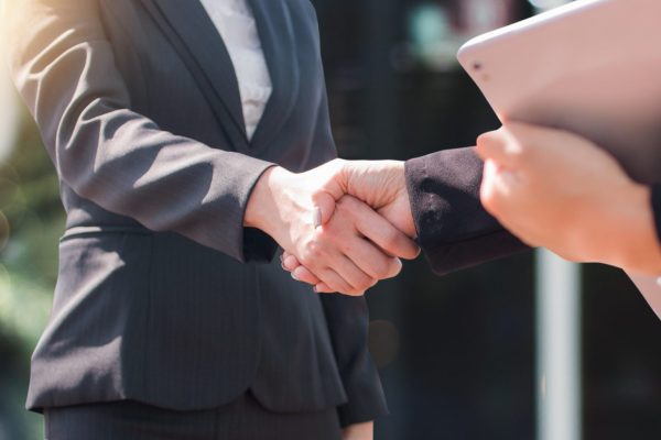 successful negotiate and handshake concept, two businessman shake hand with partner to celebration partnership and teamwork, business deal